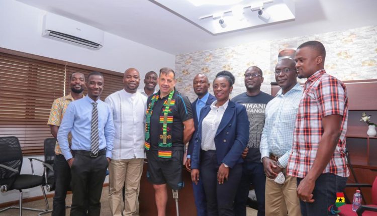 Mr. Steve Johnson, in a photograph with Samson Deen and other officials